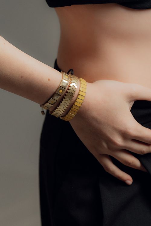 Free Close-up of a woman's hand with stylish bracelets, showcasing modern fashion accessories. Stock Photo