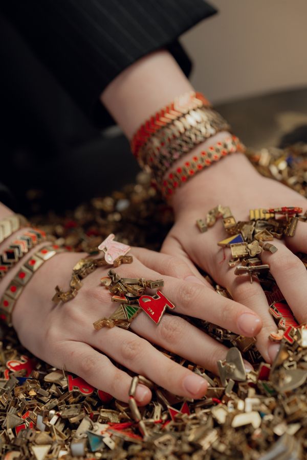 Beaded charm cluster on a wrist — photo by Seljan Salimova on Pexels