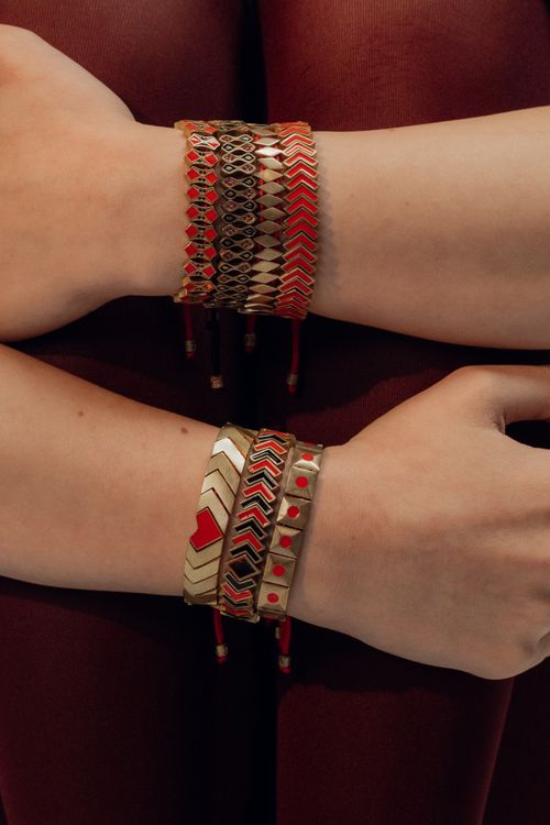 Free Close-up of vibrant handcrafted bracelets on a person's arm showcasing intricate patterns. Stock Photo