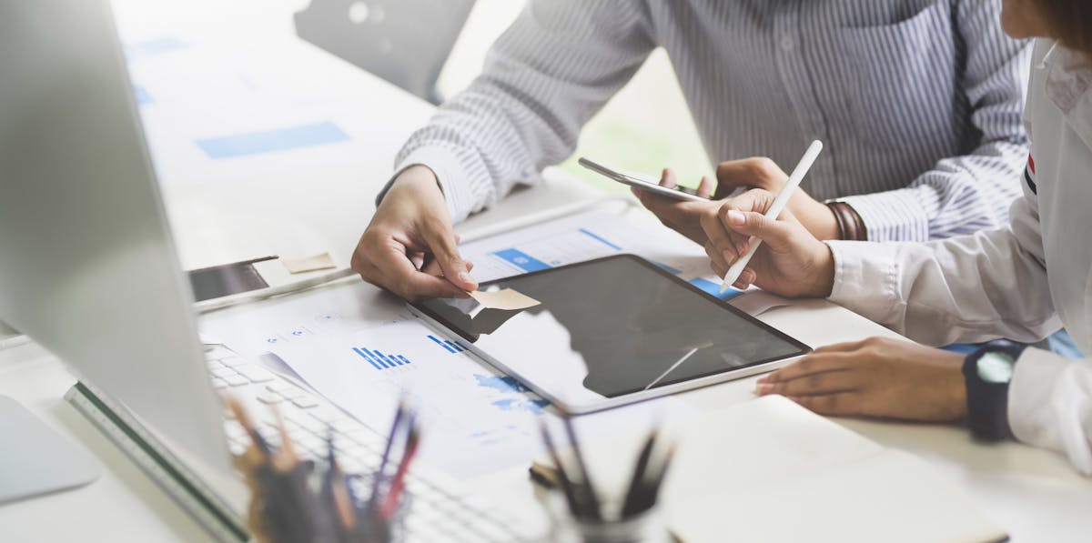 Artist arranging printed photographs