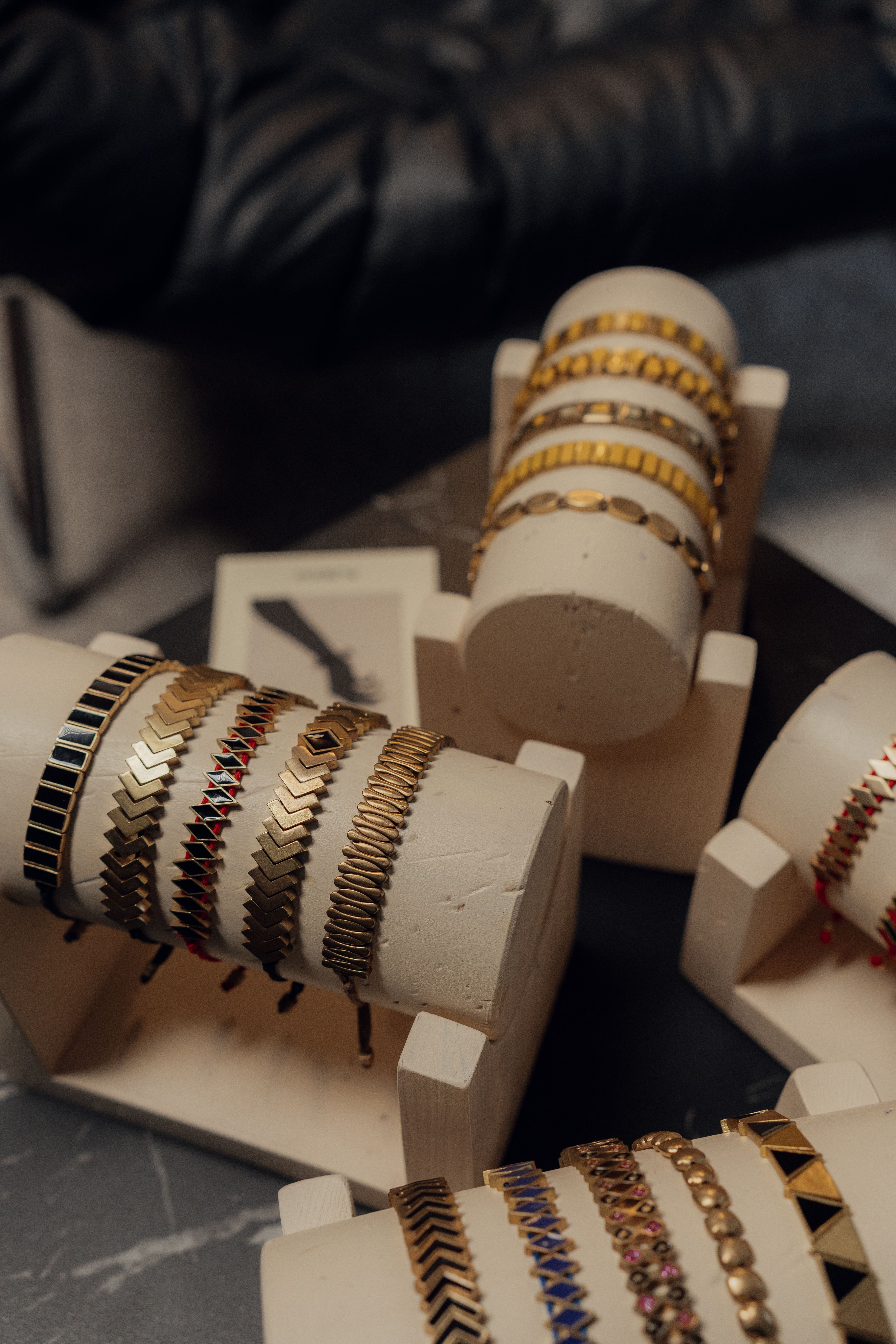 Gold bangles showcased on display stands