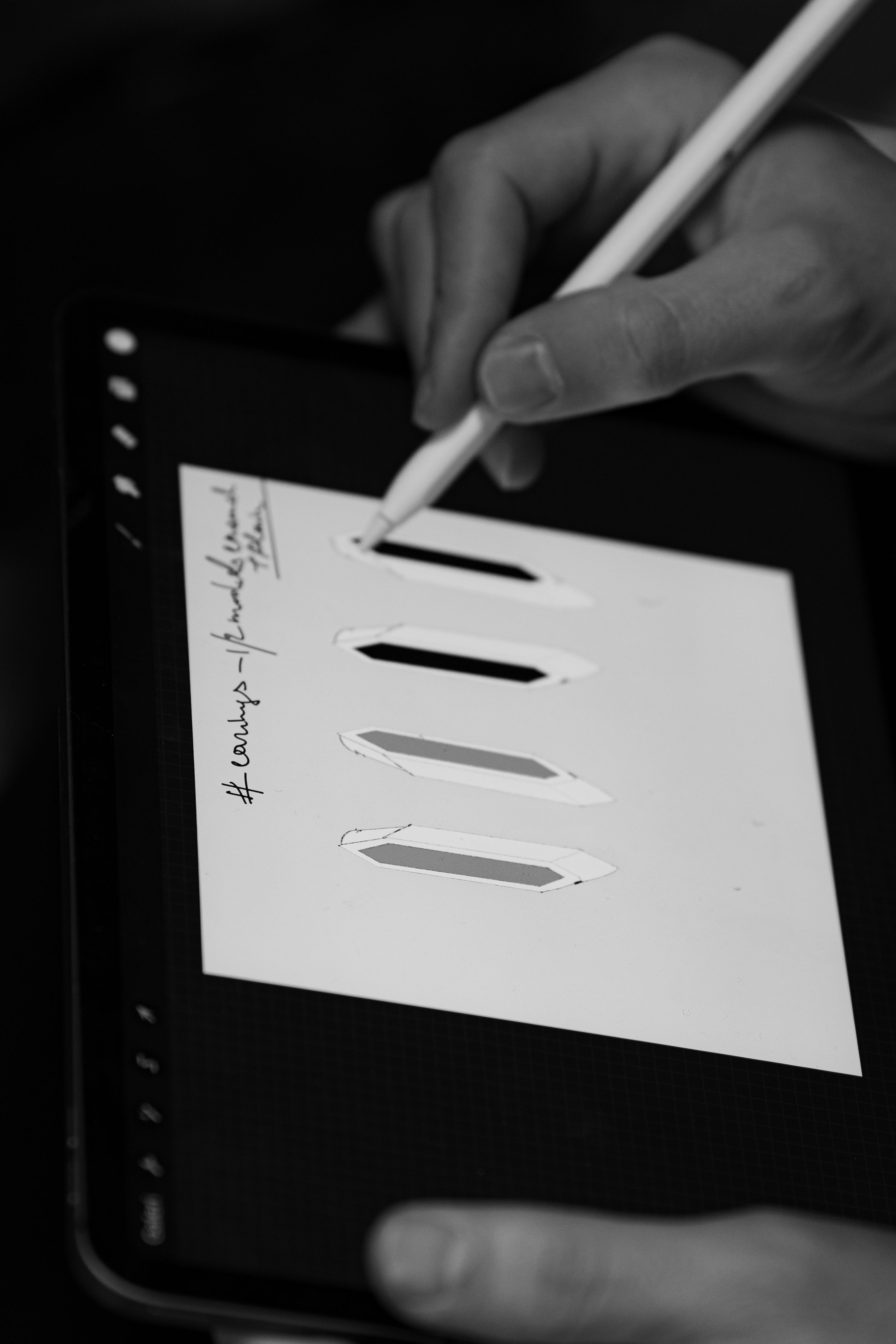 A tablet showing a signup form being filled out with a stylus