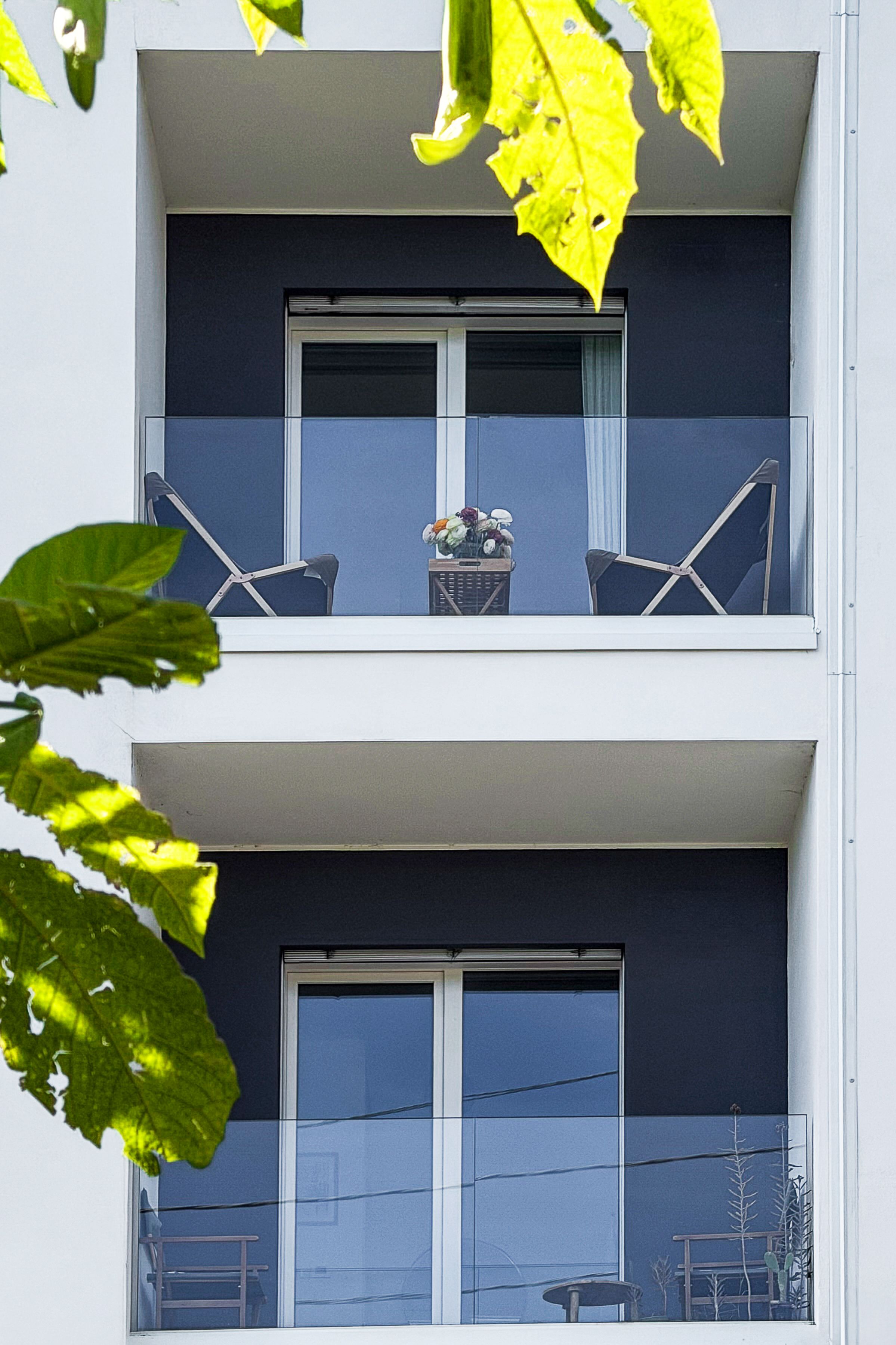 Modern Apartment Balconies with Outdoor Furniture · Free Stock Photo