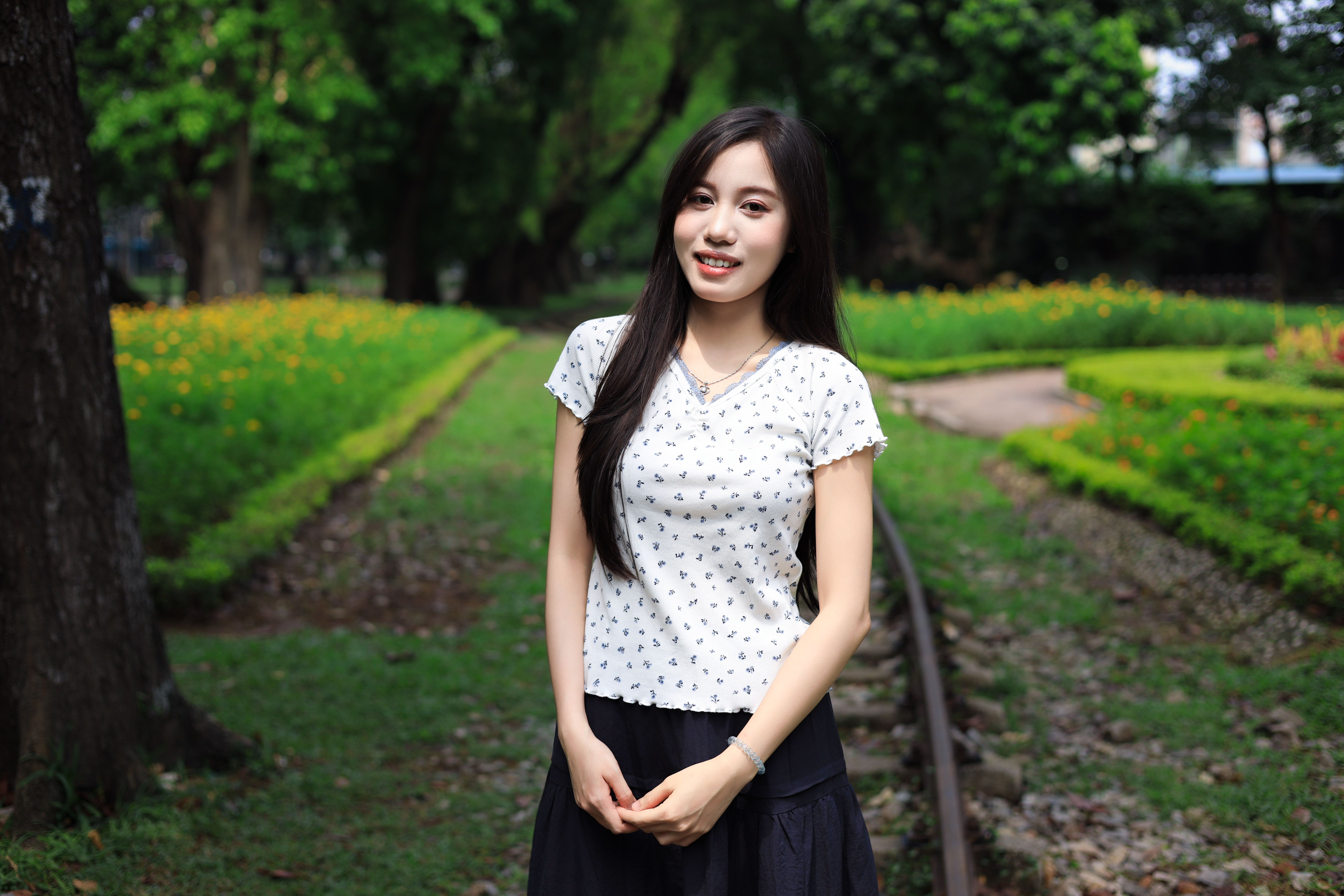 Young Woman Posing in Vietnamese Park · Free Stock Photo