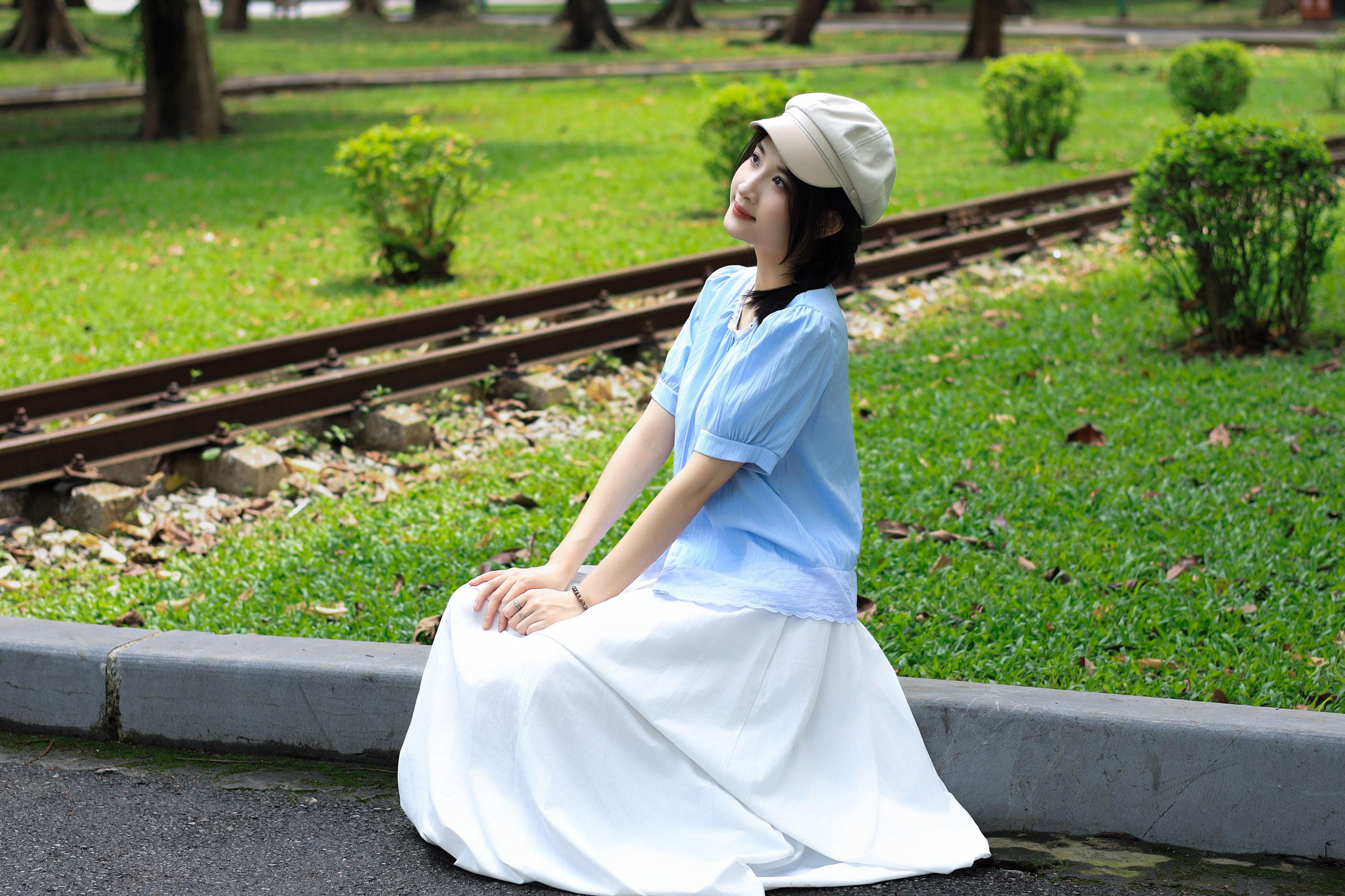 Young Woman Posing in Sunny Vietnamese Park · Free Stock Photo