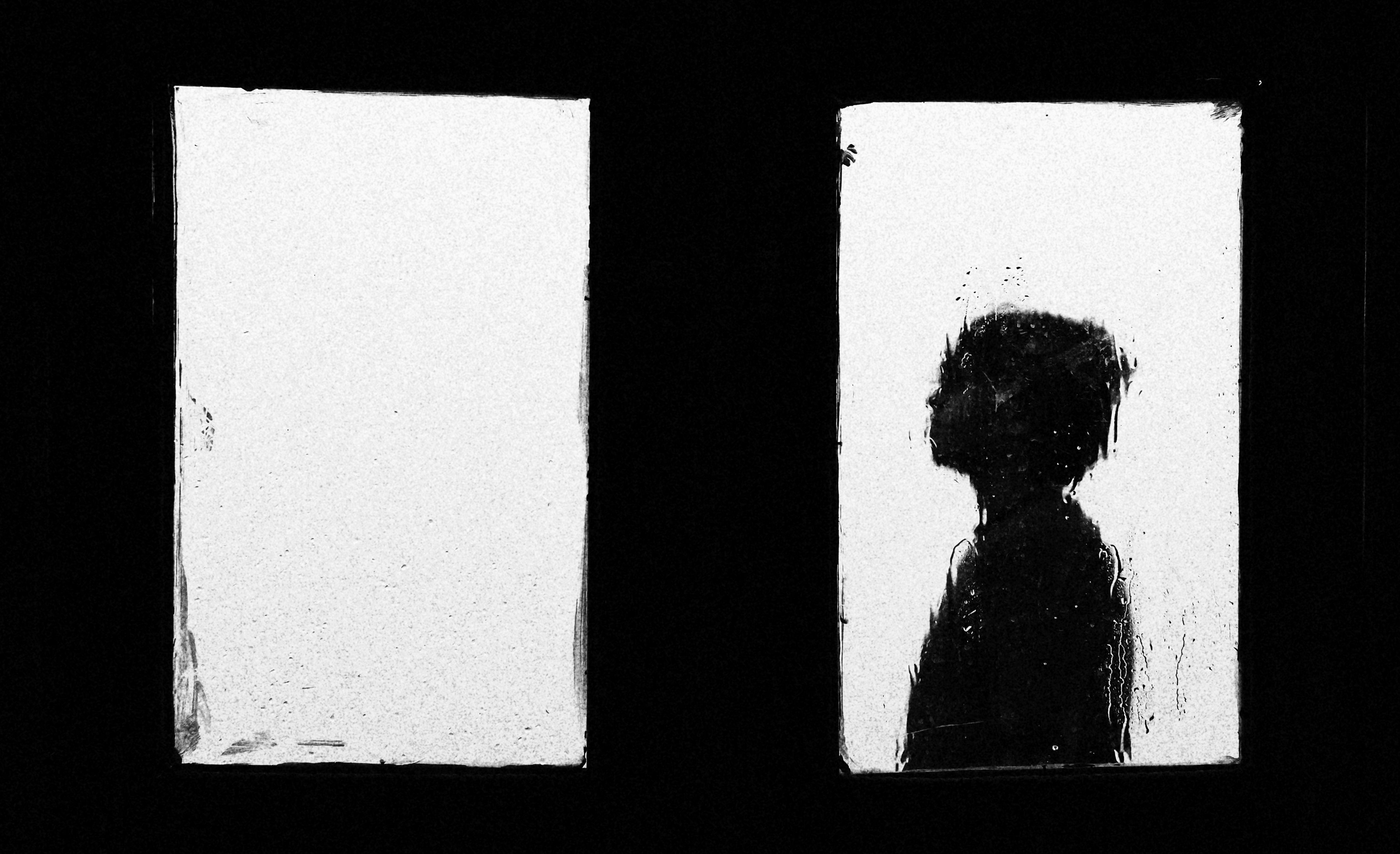 Artistic Silhouette of a Boy Behind Rainy Glass · Free Stock Photo