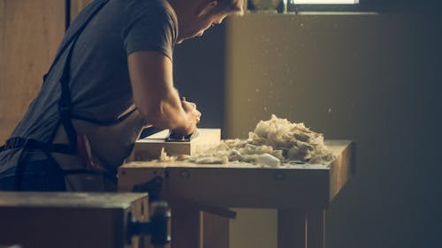 Man Standing in Front of Table