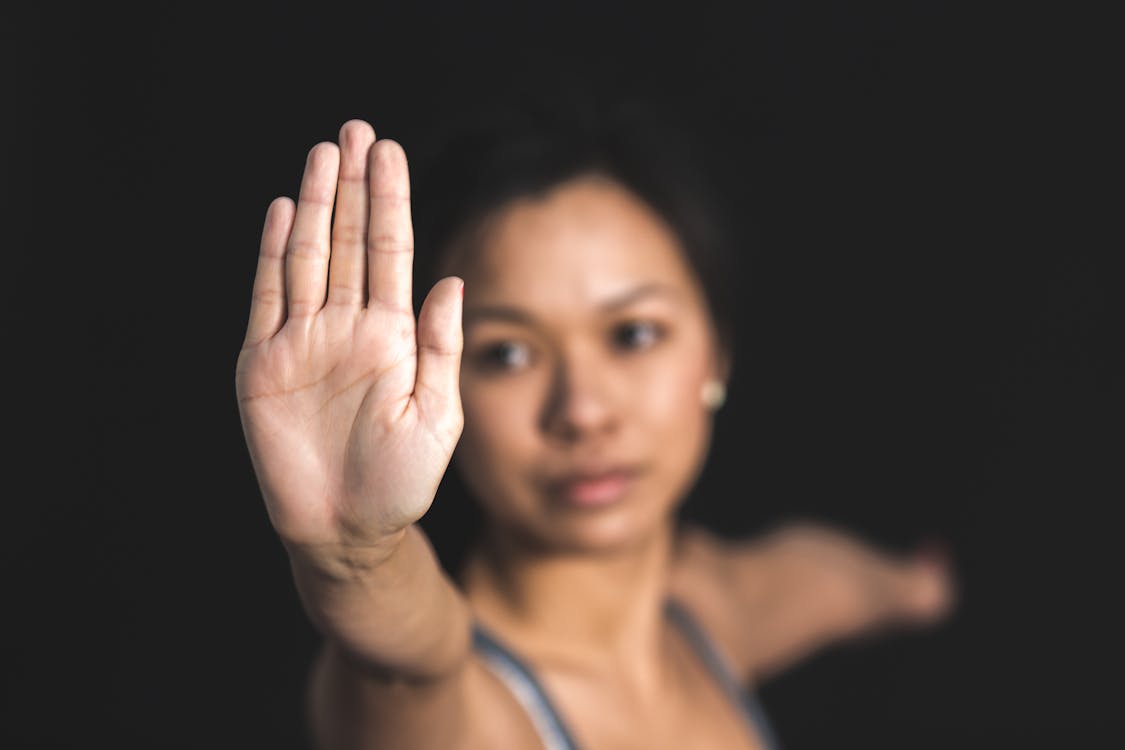 Free Woman Raising Right Hand Stock Photo