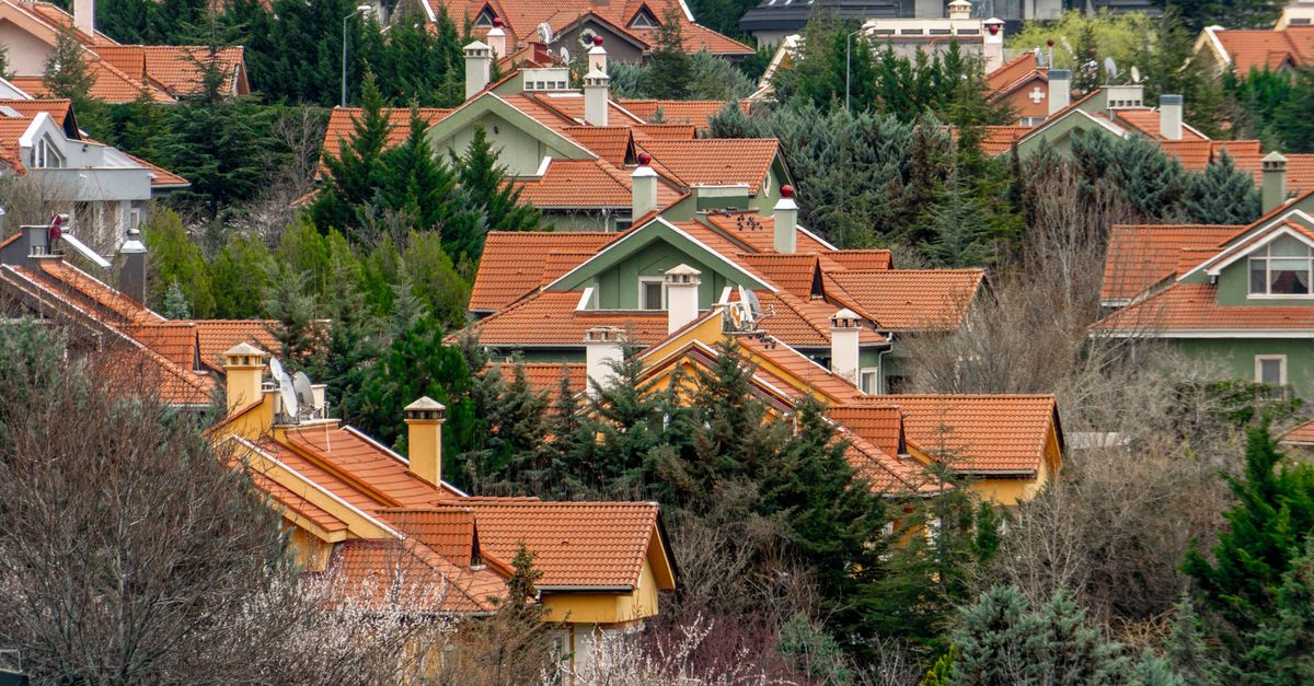 A serene neighborhood with orange rooftops surrounded by greenery in Ankara, Türkiye.
