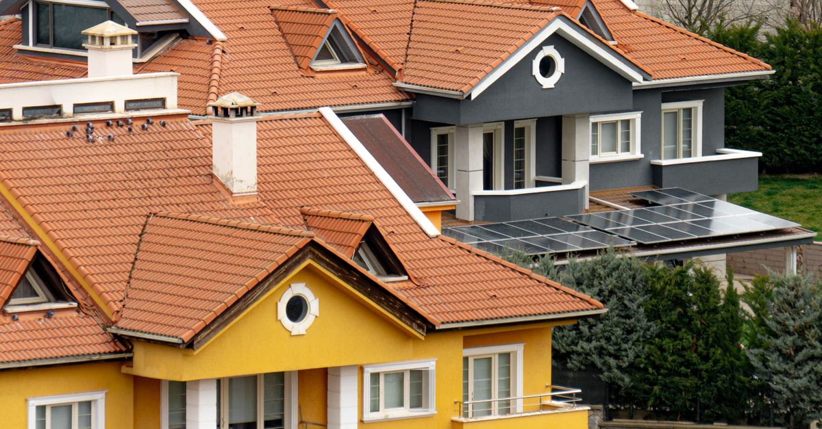 A picturesque view of colorful homes in Ankara, Türkiye, with solar panels and modern architecture.