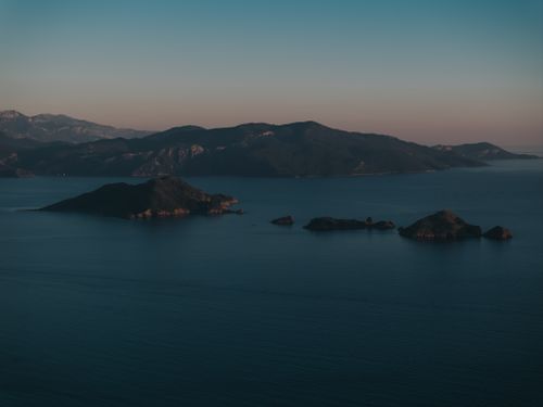 Free A tranquil aerial view capturing the serene beauty of a Turkish island during twilight. Stock Photo