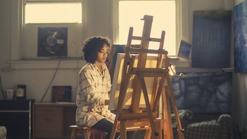 Free Photo of Woman Painting in Brown Wooden Easel Stock Photo