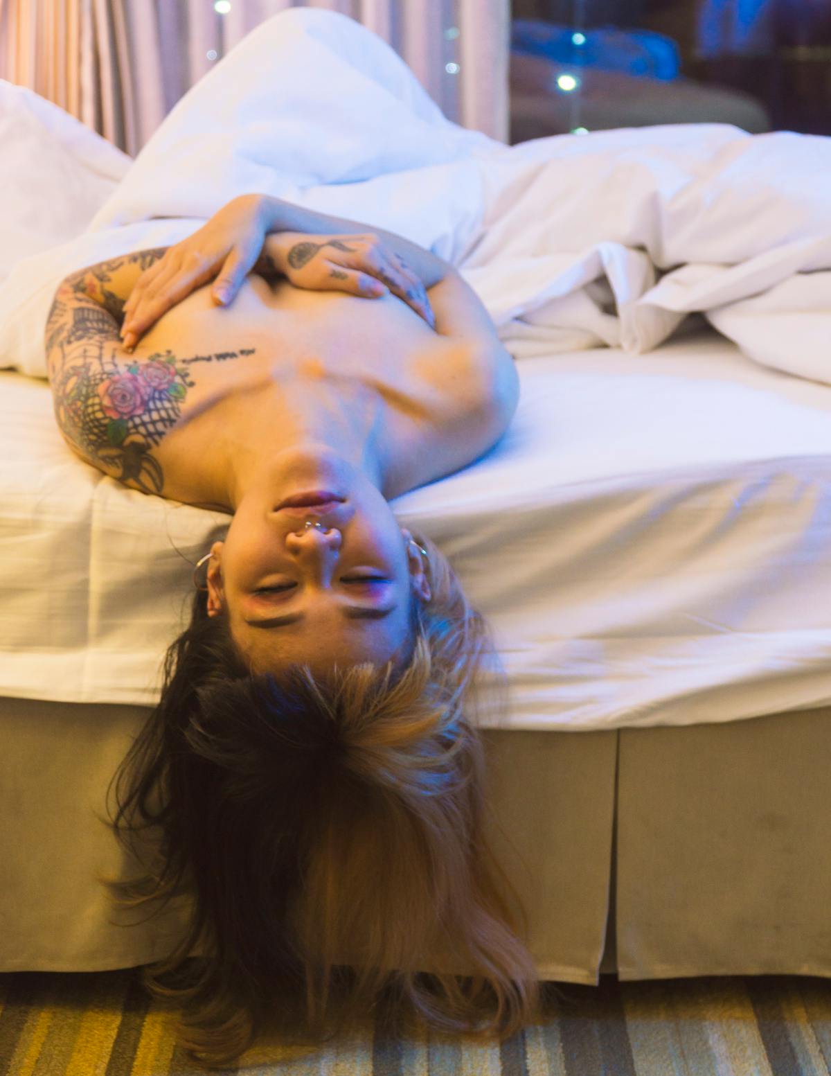 Person working at a minimalist desk with laptop and smart devices