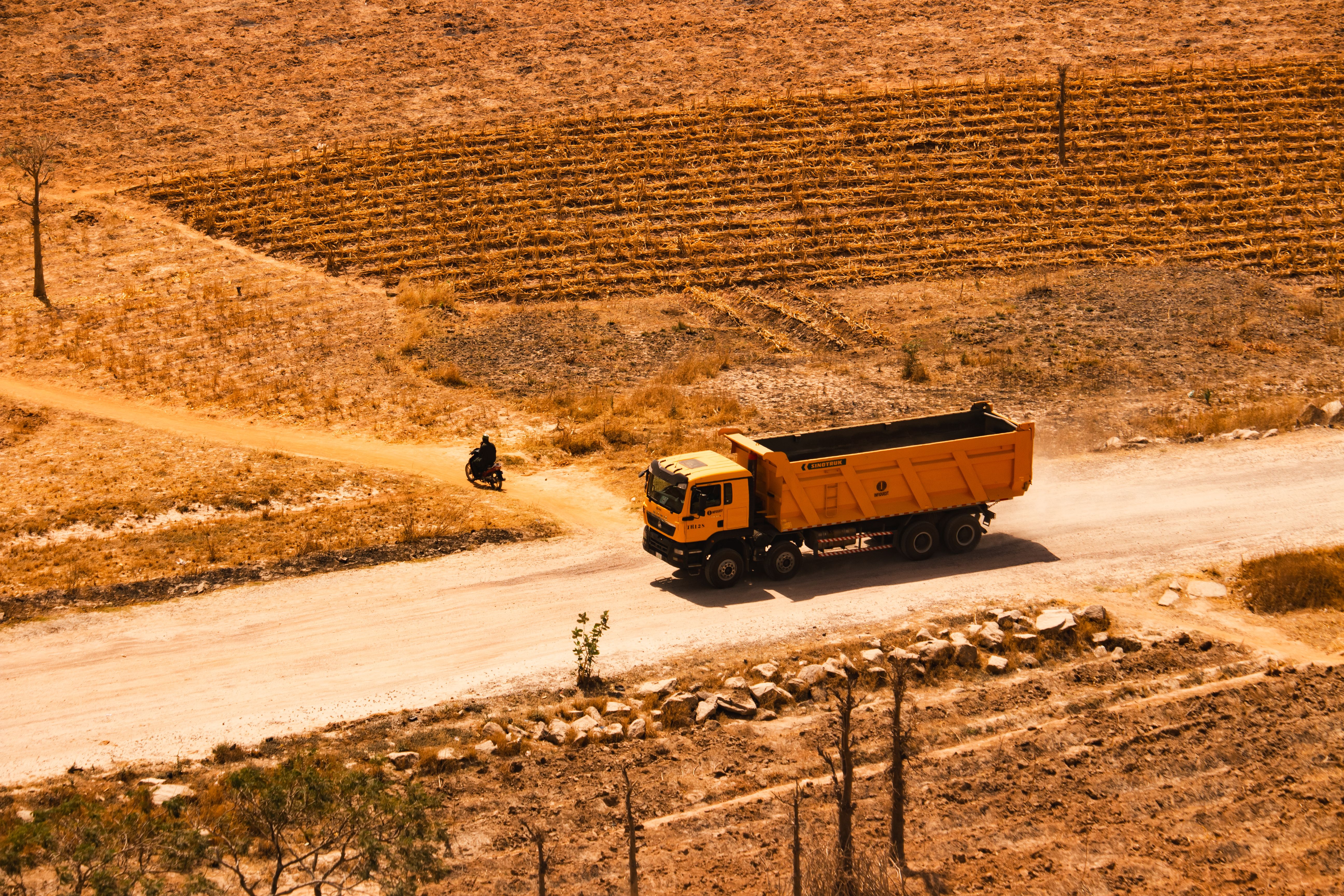 A car driving safely on a well-maintained road in the Jordanian desert
