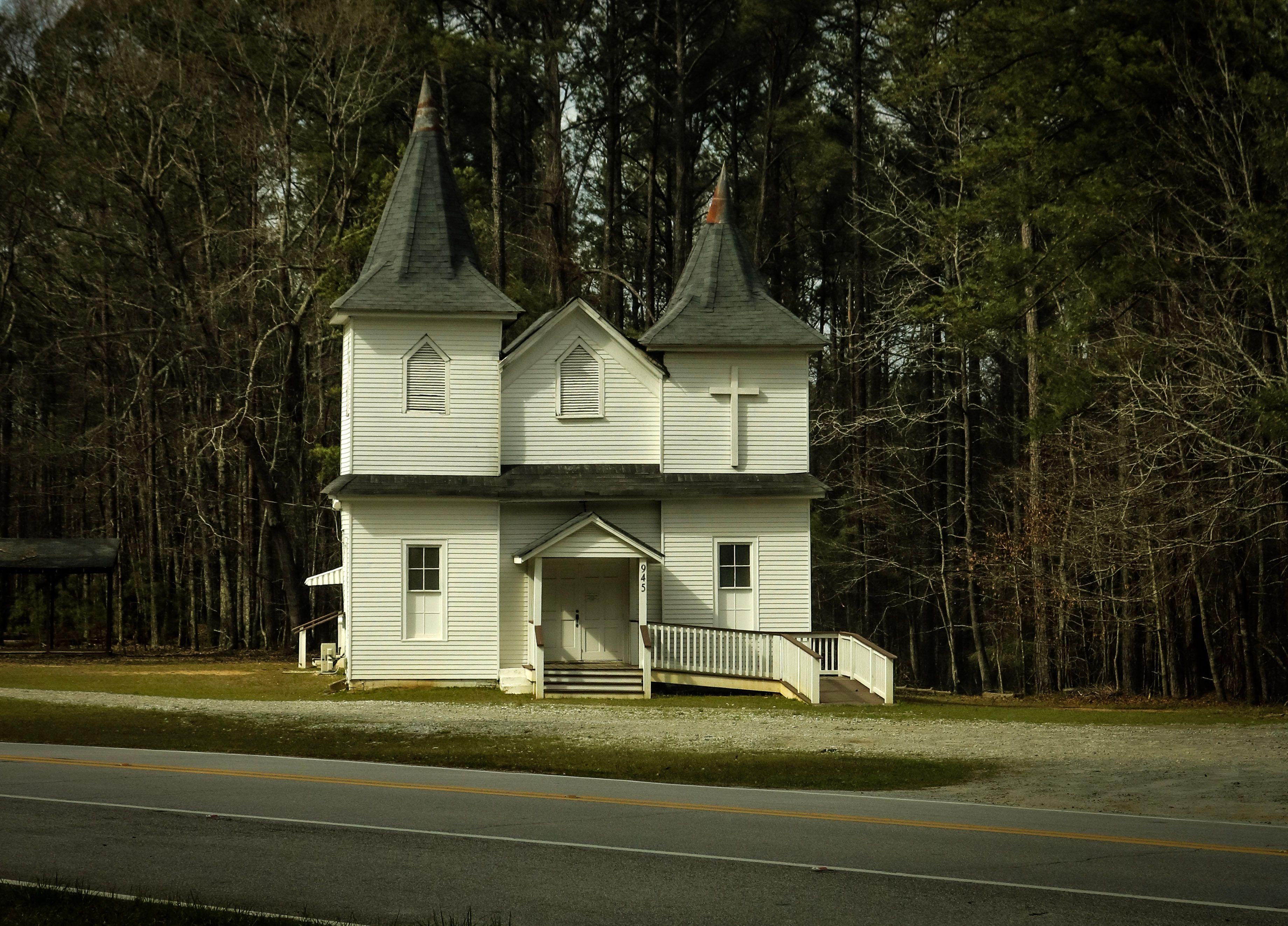 Rustic White Church Surrounded by Forest · Free Stock Photo
