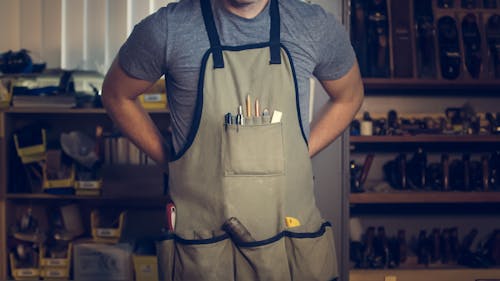 Photo of Man Wearing Gray Shirt and Apron