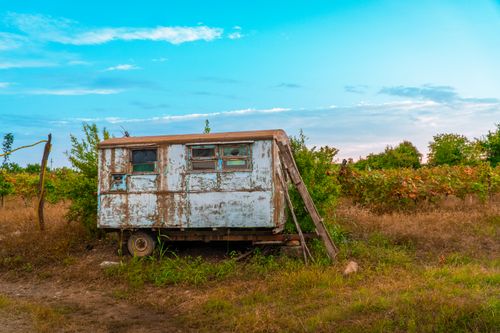 Free A vintage, abandoned trailer in a vineyard in Kakheti, Georgia, under a bright sky. Stock Photo