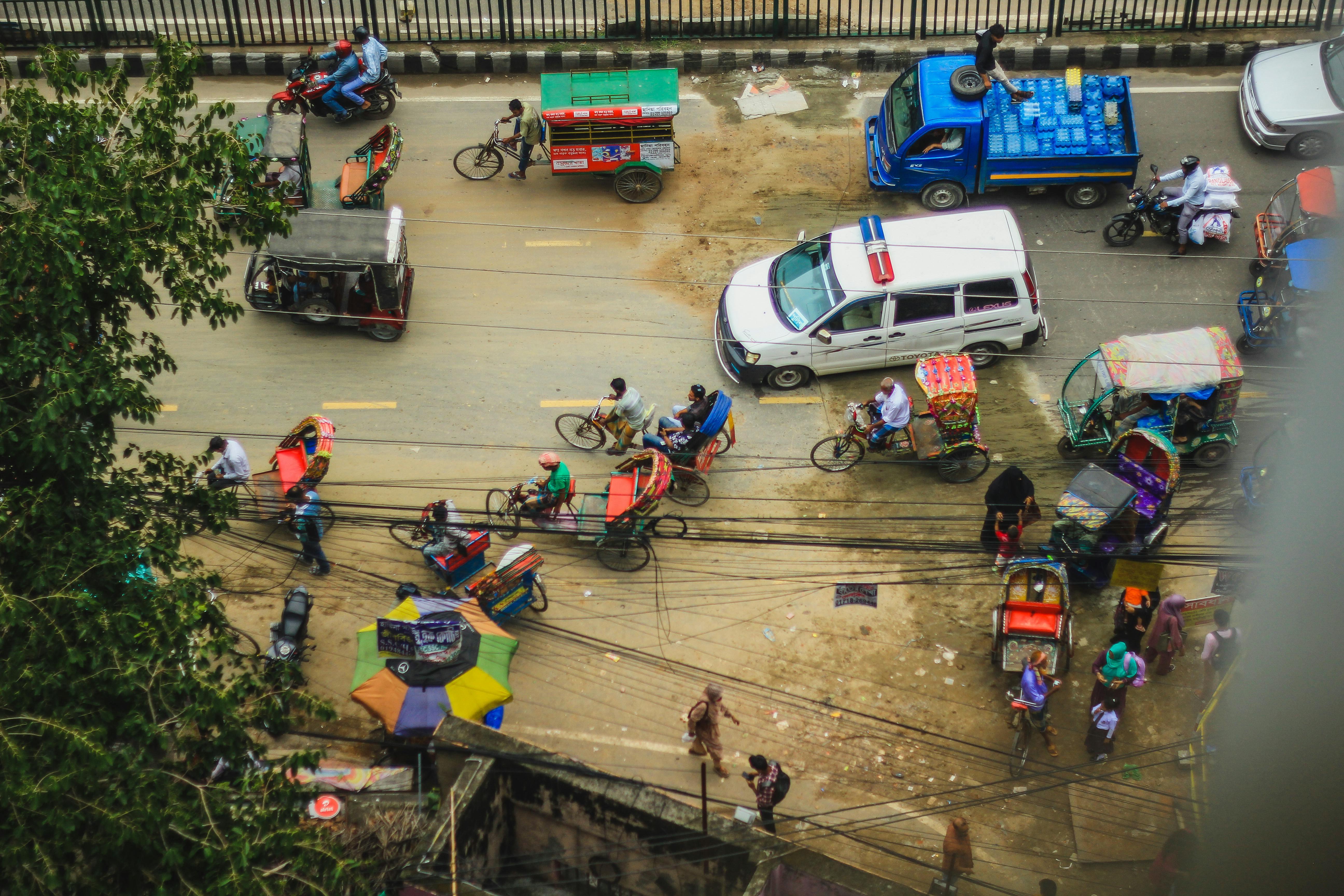 yellow auto rickshaw traffic dhaka