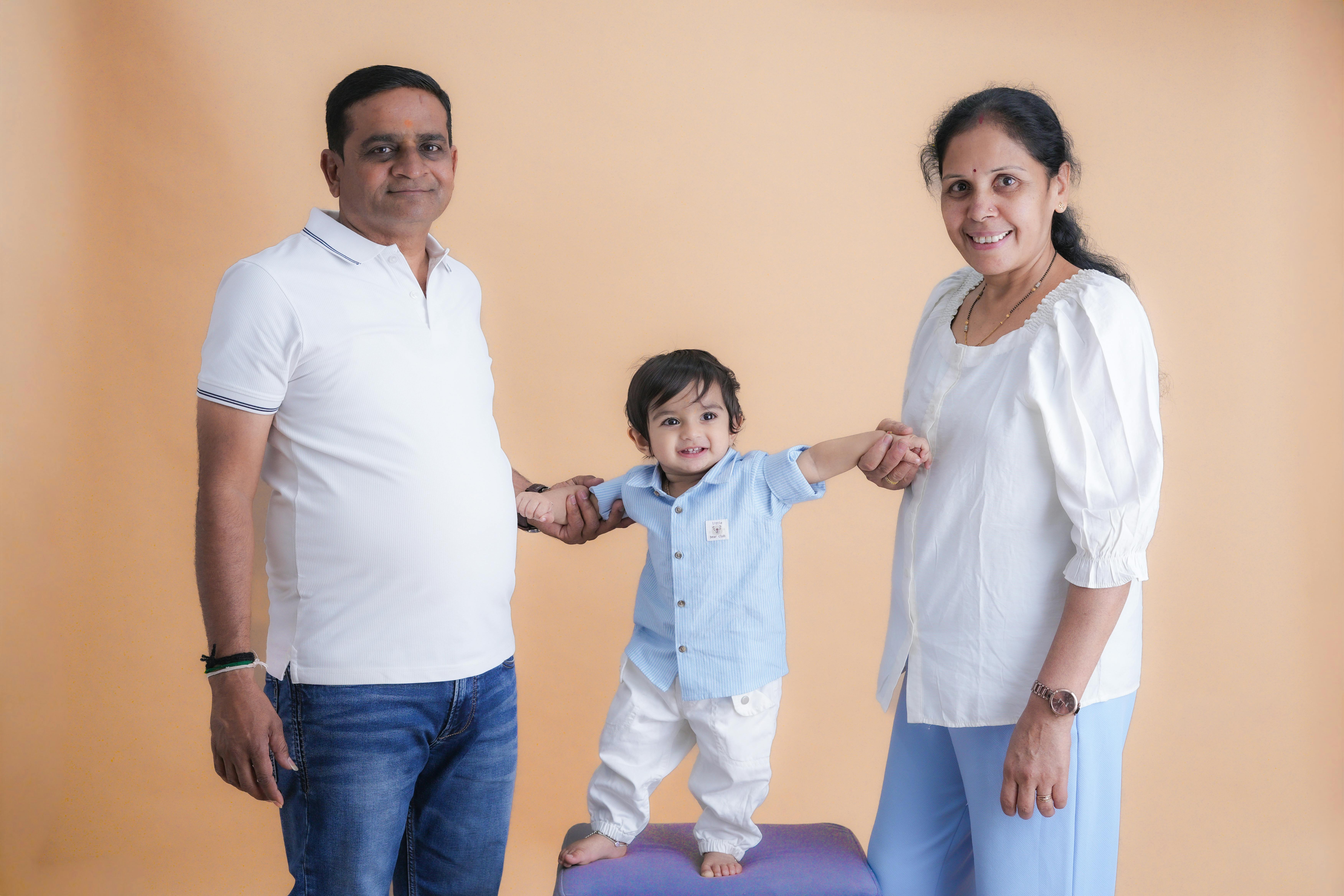 three generations family grandparents parents toddler together