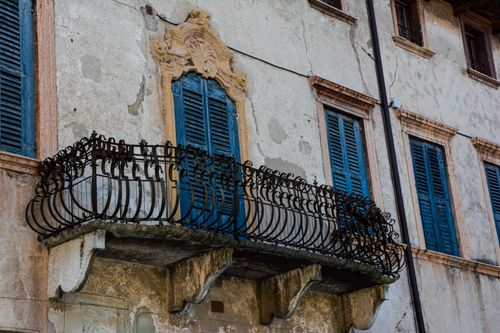 Free Detailed view of an ornate iron balcony on an old Venetian building in Verona, Italy. Stock Photo