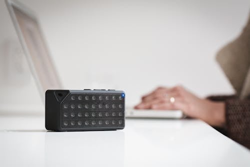 Black Bluetooth Speaker on White Table