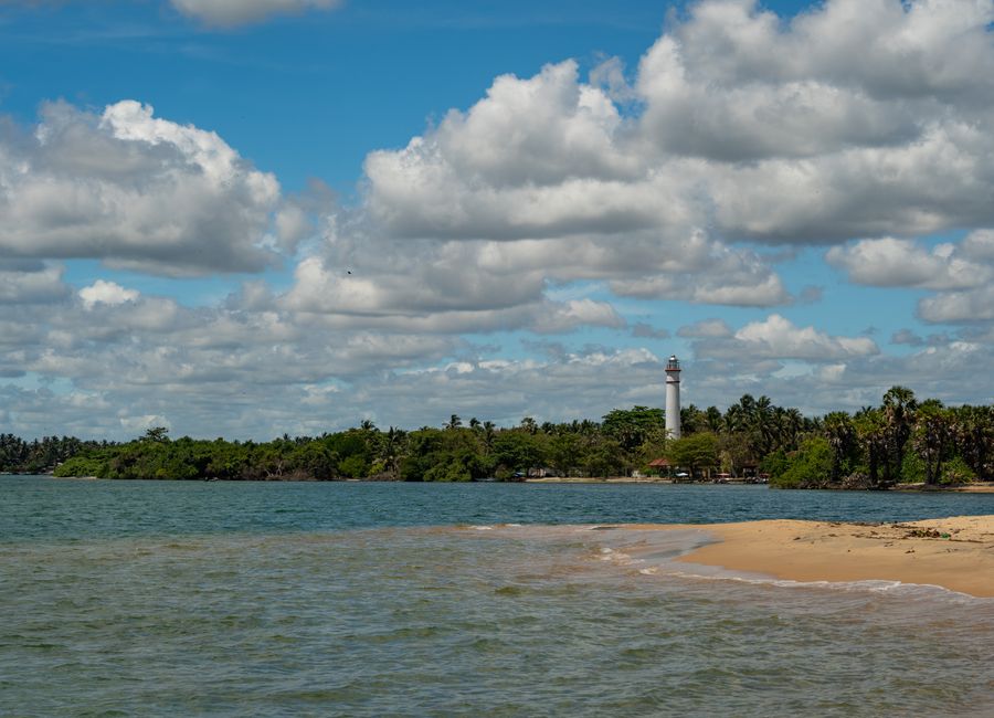 Explore the serene beauty of Batticaloa Lagoon with its iconic lighthouse on a sunny day in Sri Lanka.
