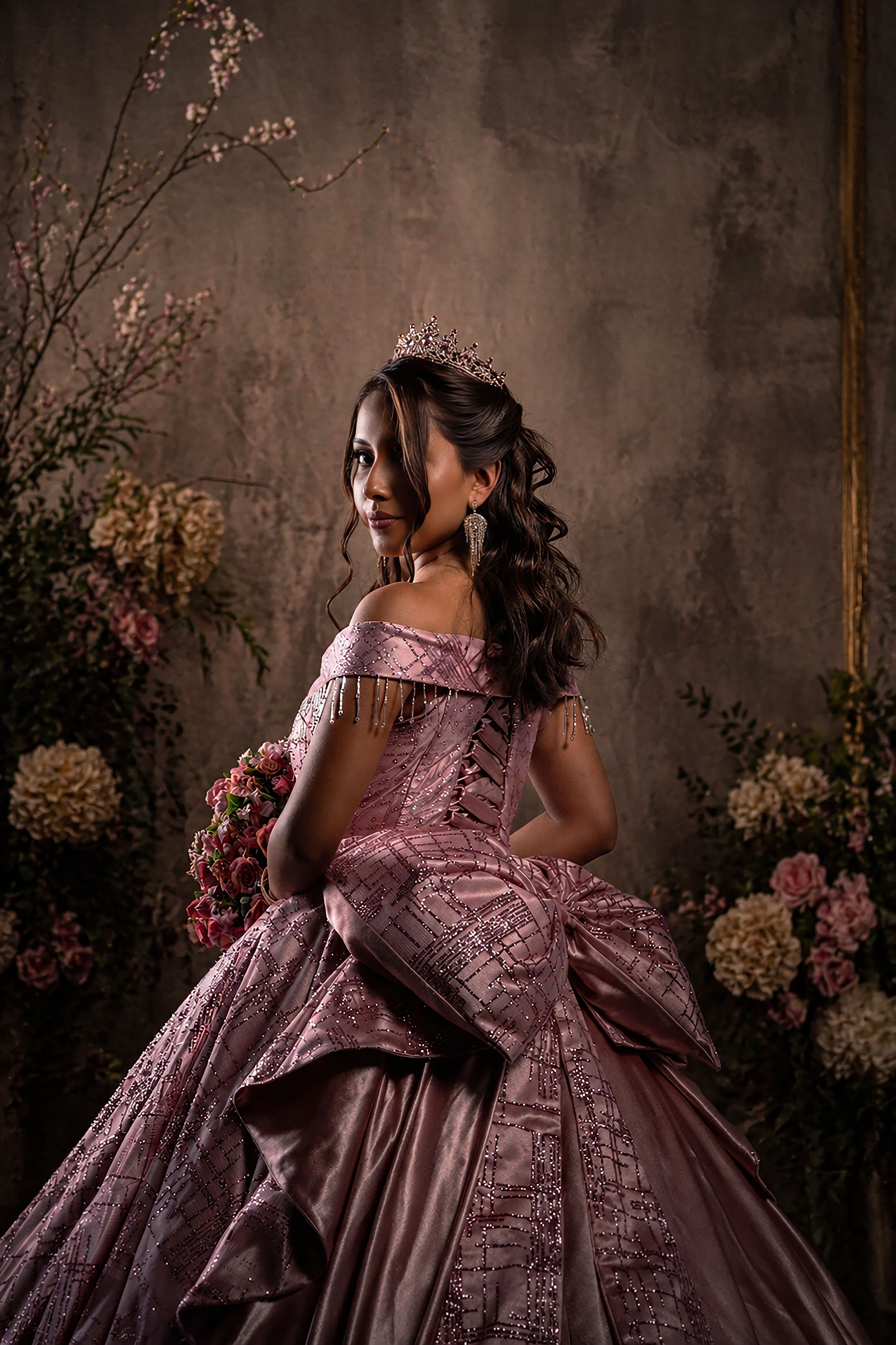 Captivating portrait of a girl in an exquisite gown celebrating her quinceañera.