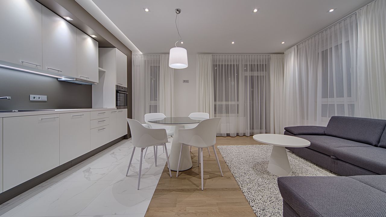 Modern co living apartment common area Modern apartment living room and kitchen representing a shared co living space