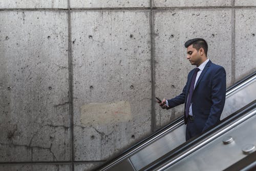 Man Looking at His Phone