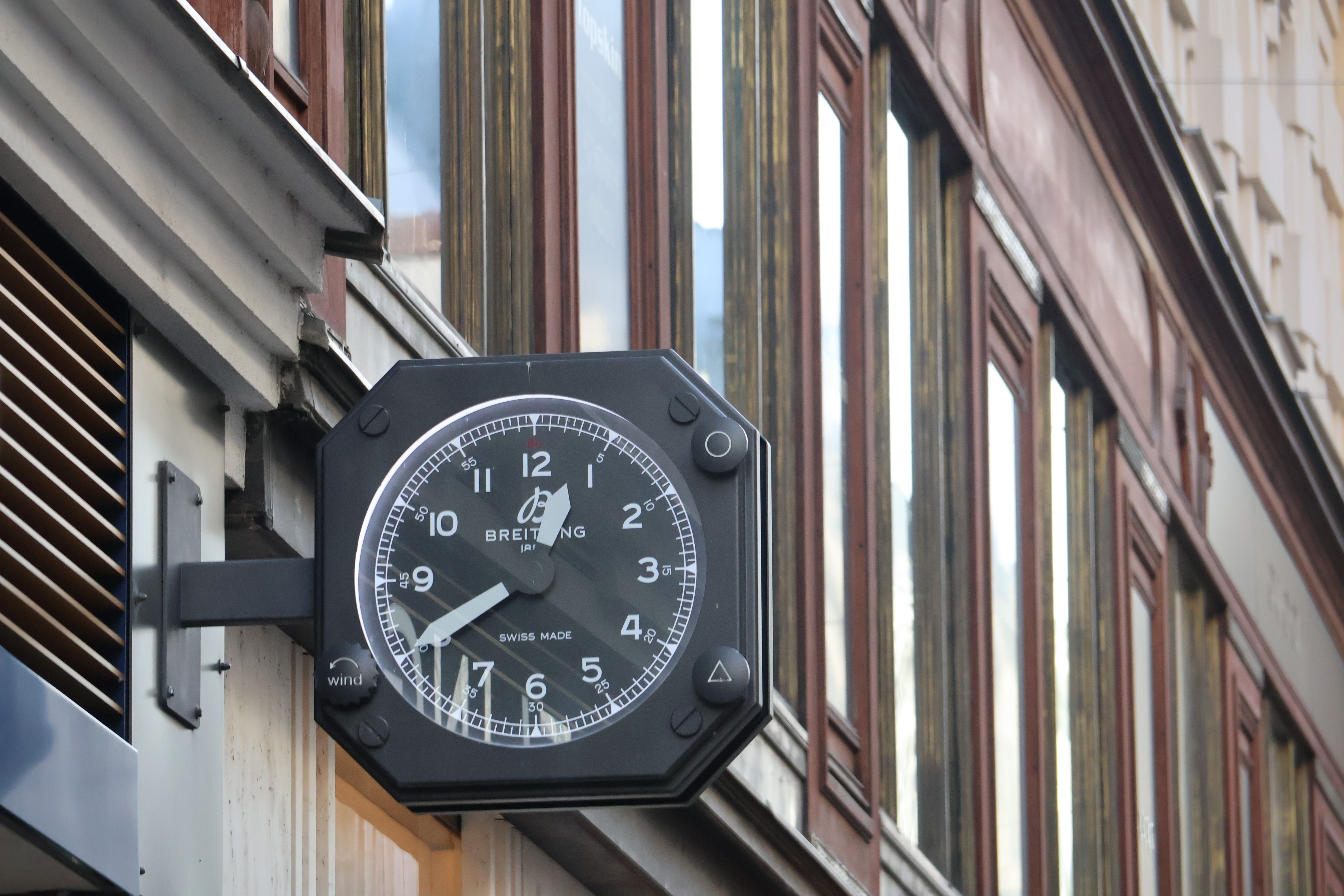 Outdoor Wall-Mounted Breitling Clock on Building · Free Stock Photo