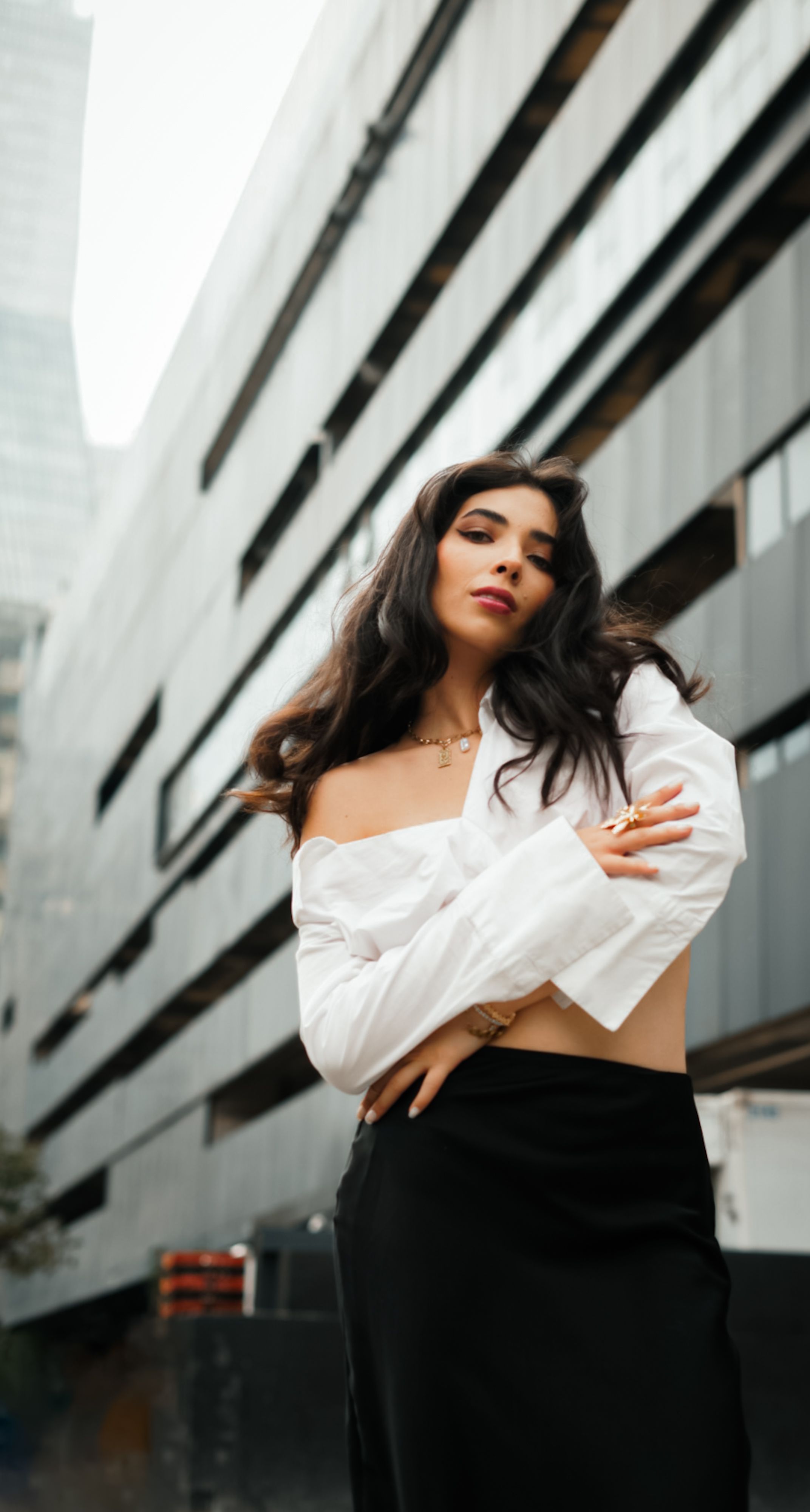 Stylish Woman Posing in Urban Setting · Free Stock Photo