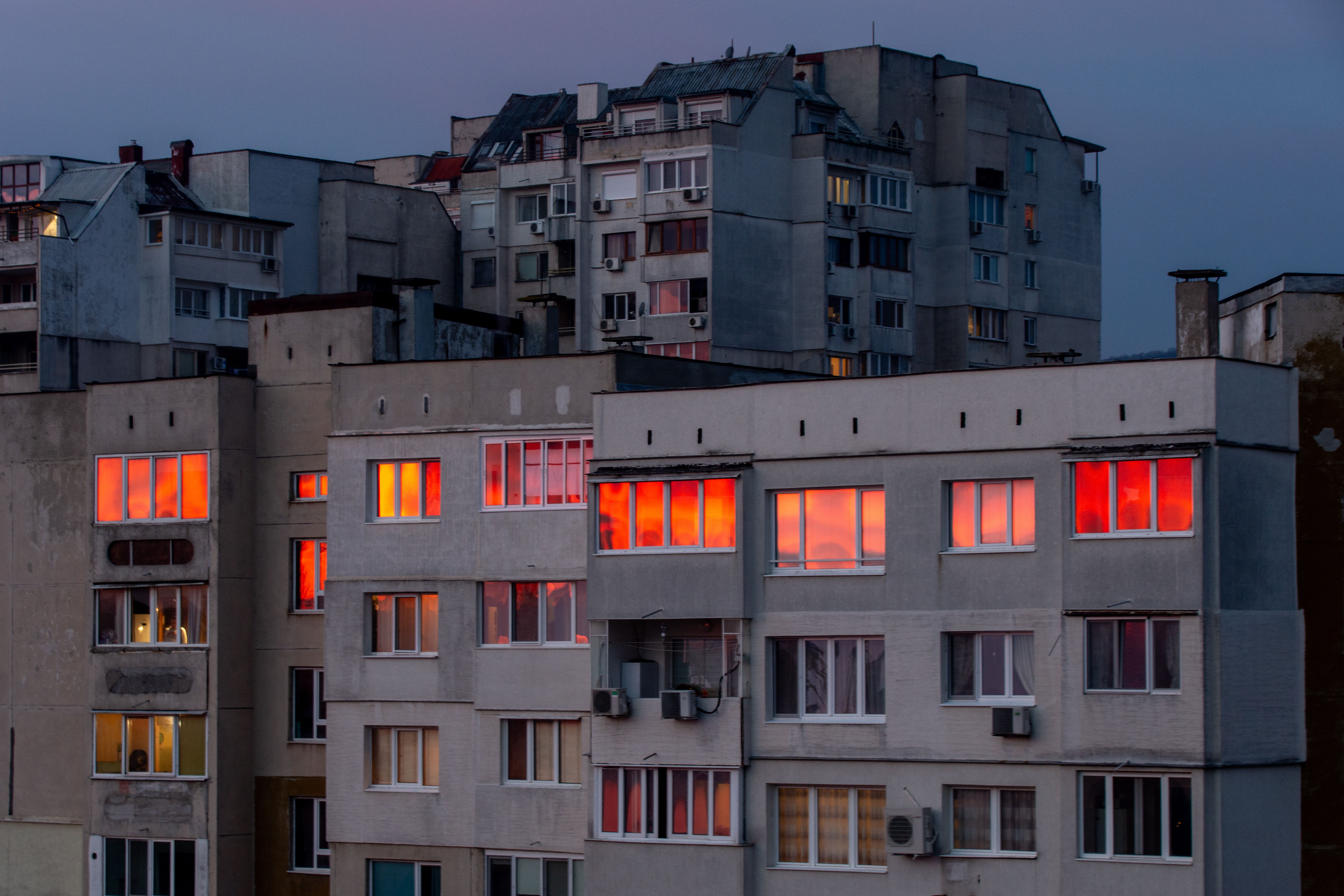 Dramatic Sunset Reflects on Urban Building Windows · Free Stock Photo