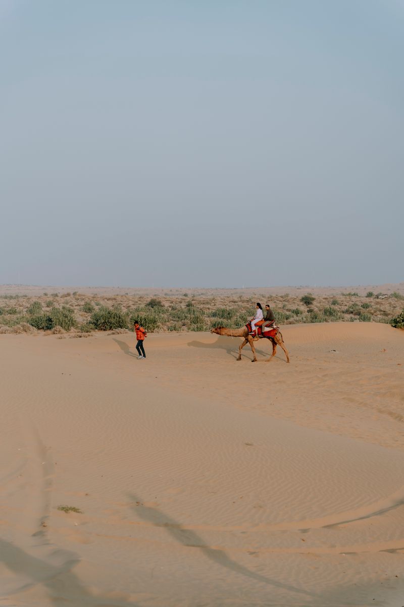 Rider crossing the wide open sands of the Thar Desert near Jaisalmer