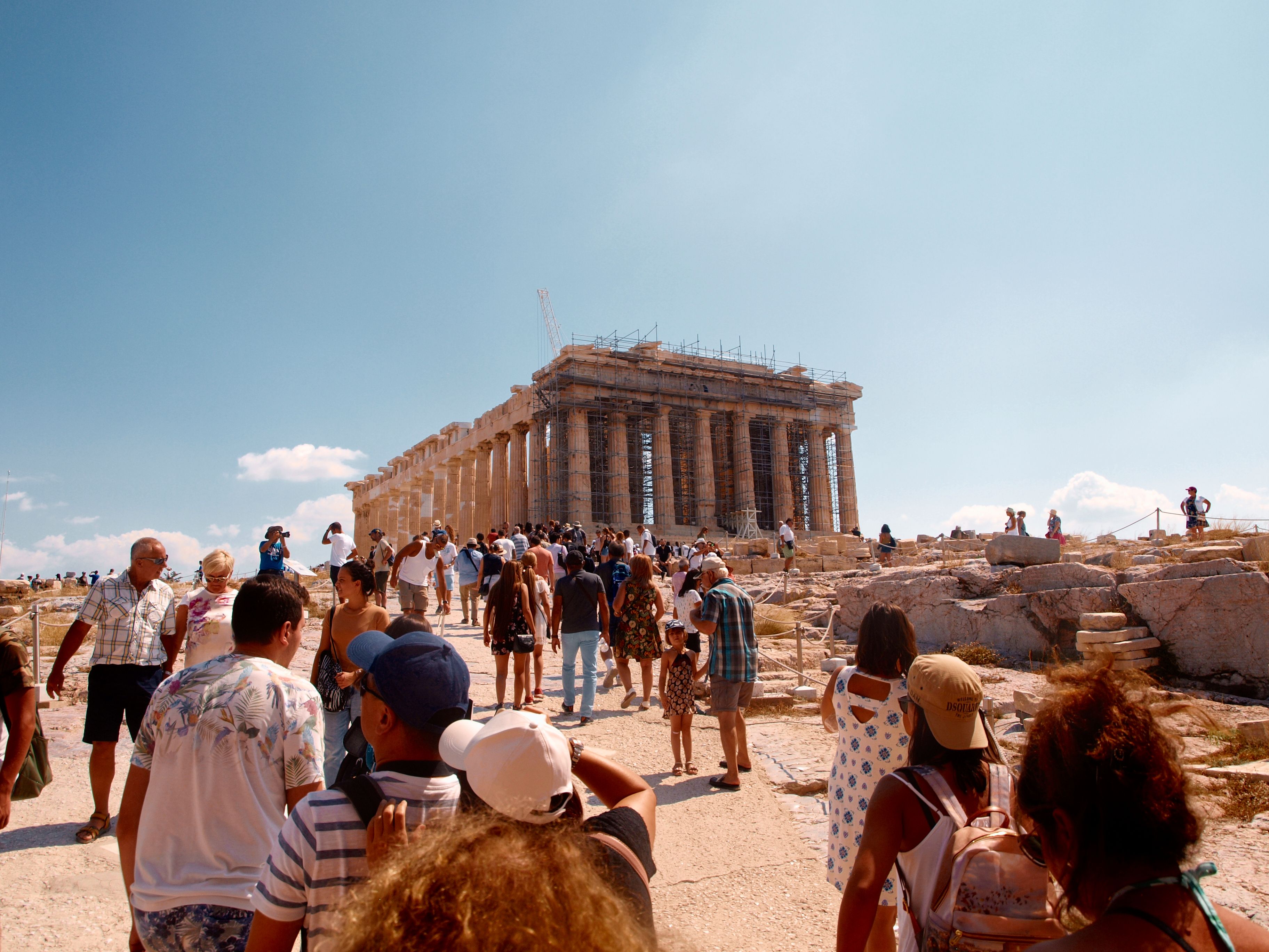 Tourists Explore the Ancient Parthenon in Athens · Free Stock Photo