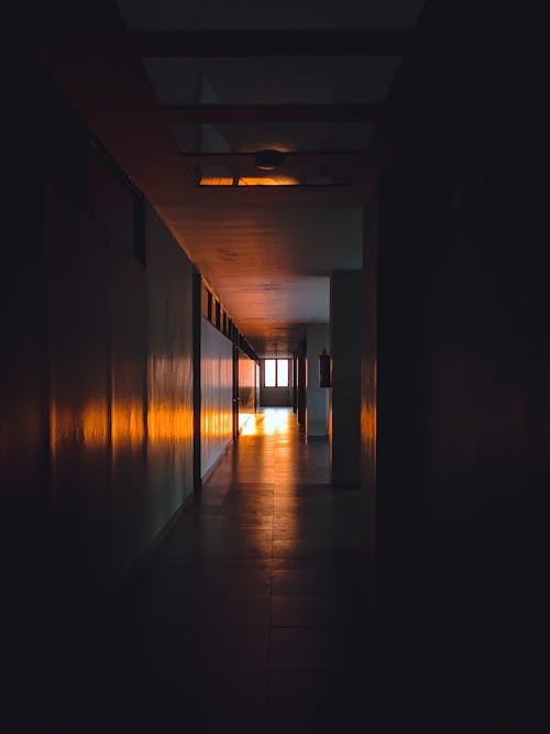 Empty dark corridor of building