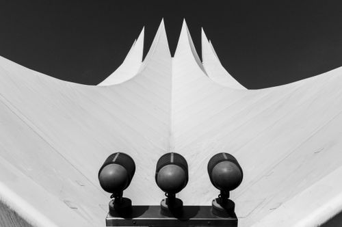 Free Artistic black and white photo of the iconic roof of Berlin's Tempodrom with spotlights. Stock Photo