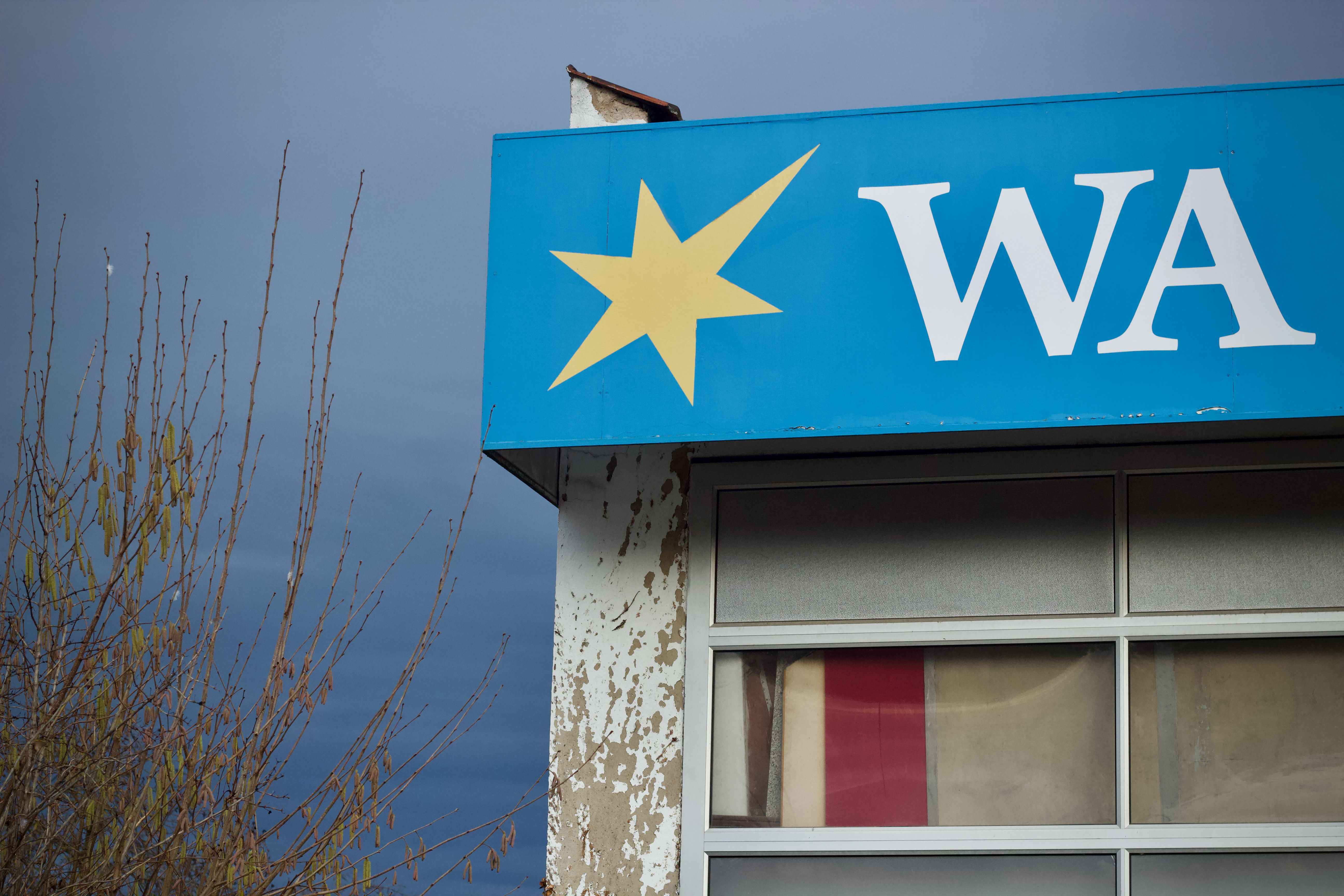 Vintage Storefront with Star Logo on Blue Sign · Free Stock Photo