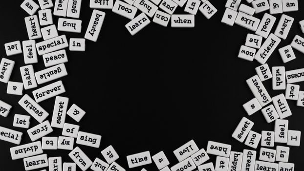 Random words spread on a black background, ideal for creativity and editorial designs.