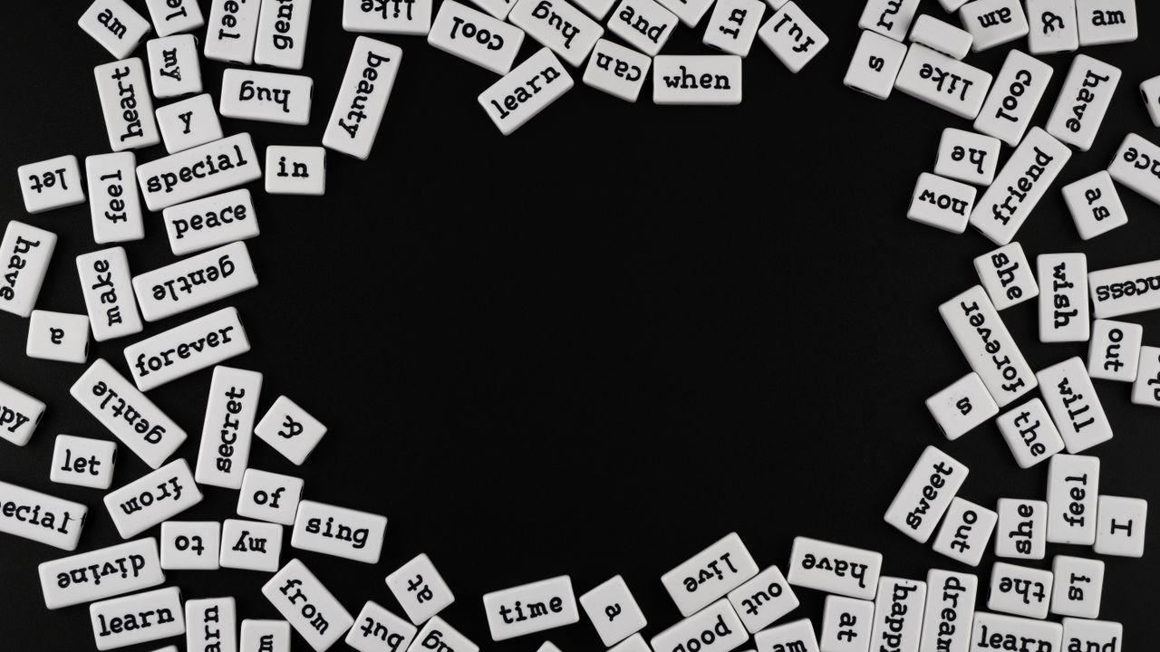 random words spread on a black background ideal for creativity and edi
