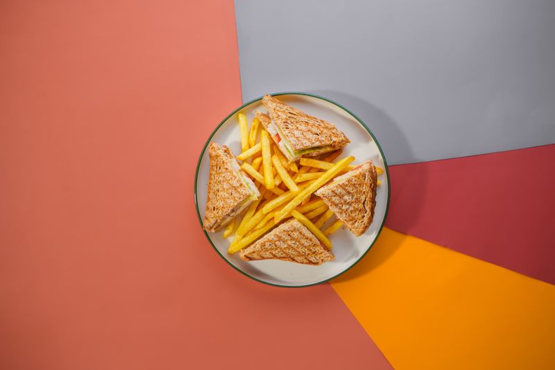 Club sandwich with fries overhead