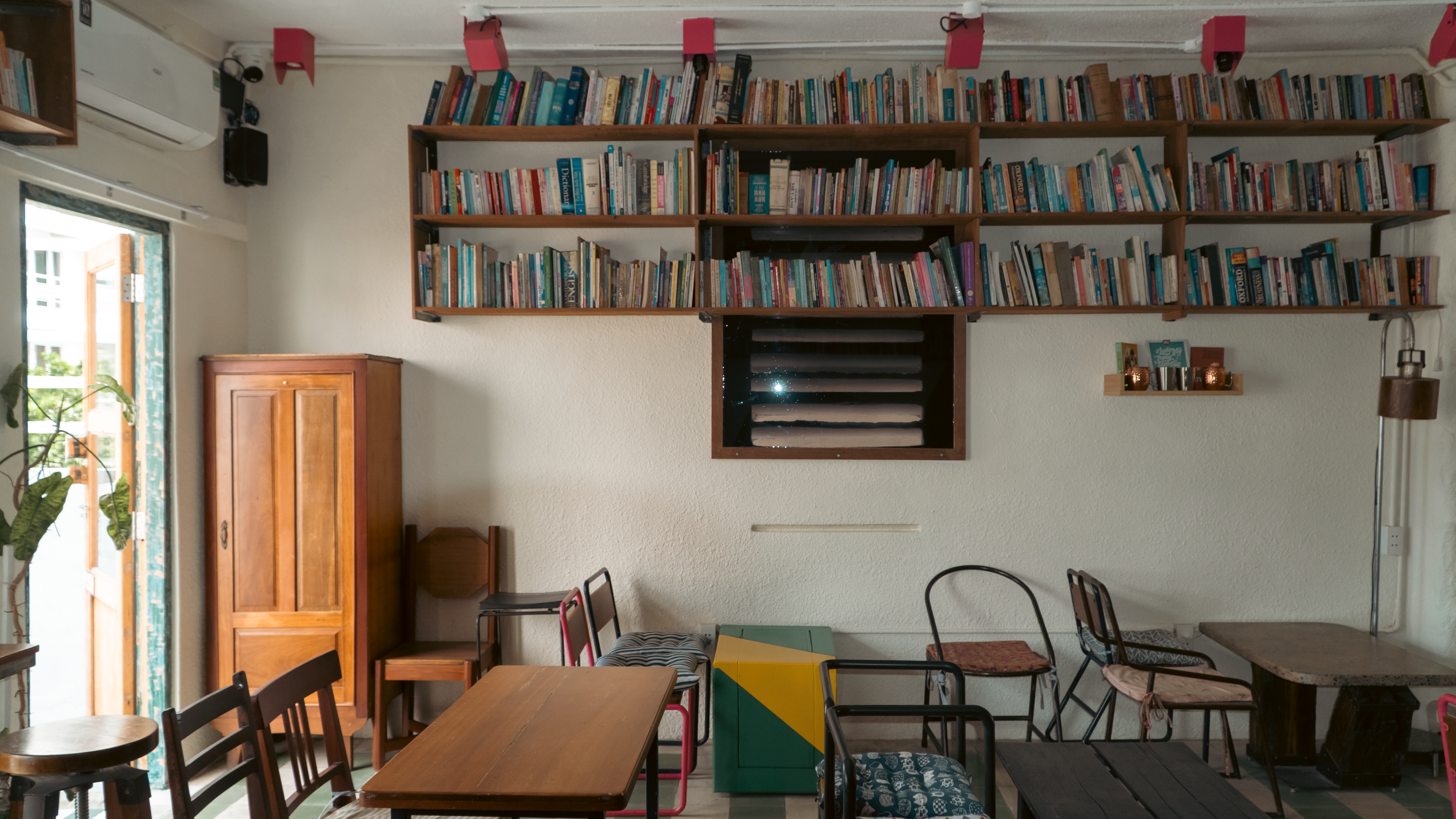 Editorial photograph of a quiet Seoul independent bookshop interior with timber shelving and a reading nook