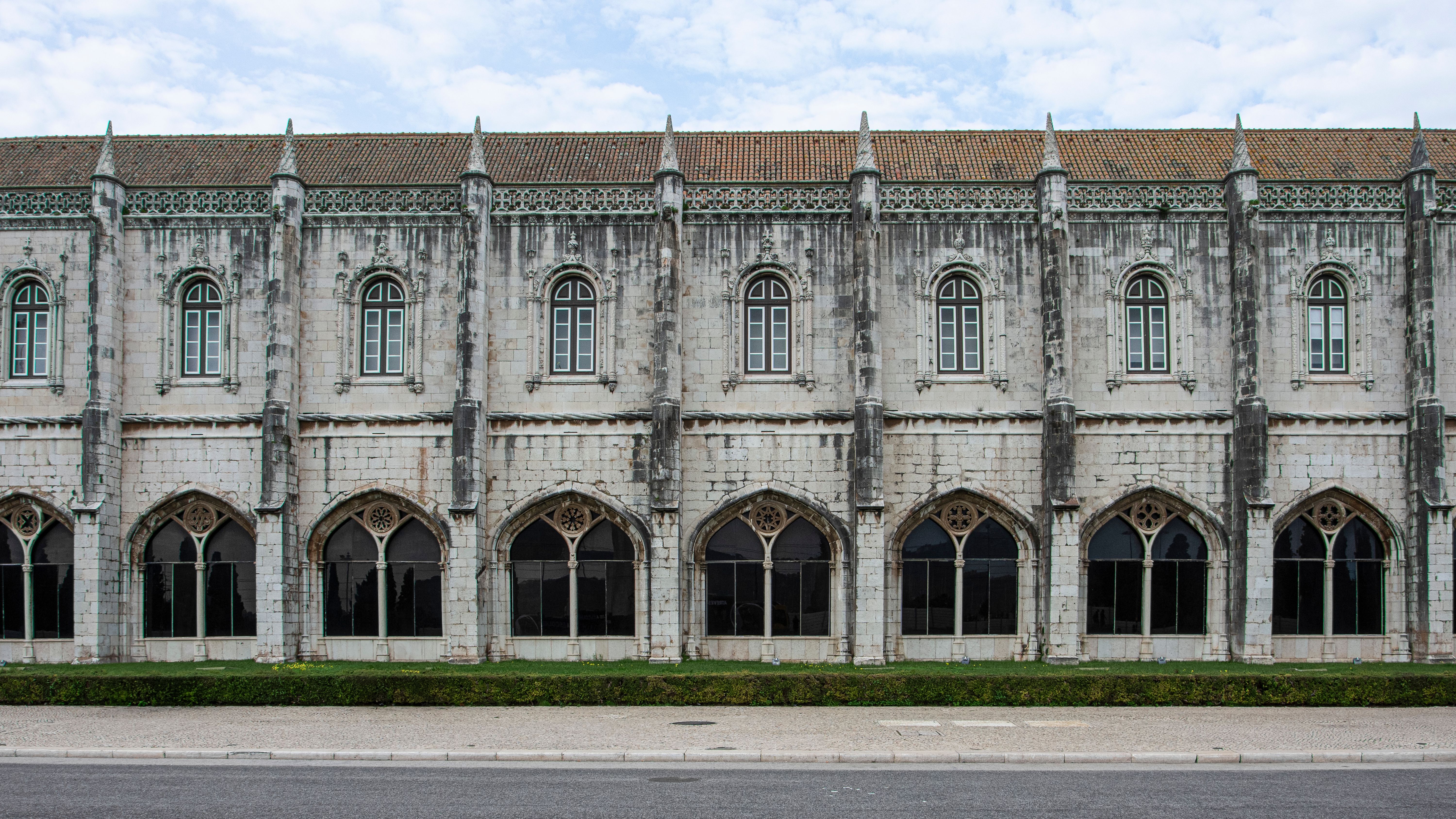 Roofless gothic arches of the Carmo convent open to the sky above Lisbon