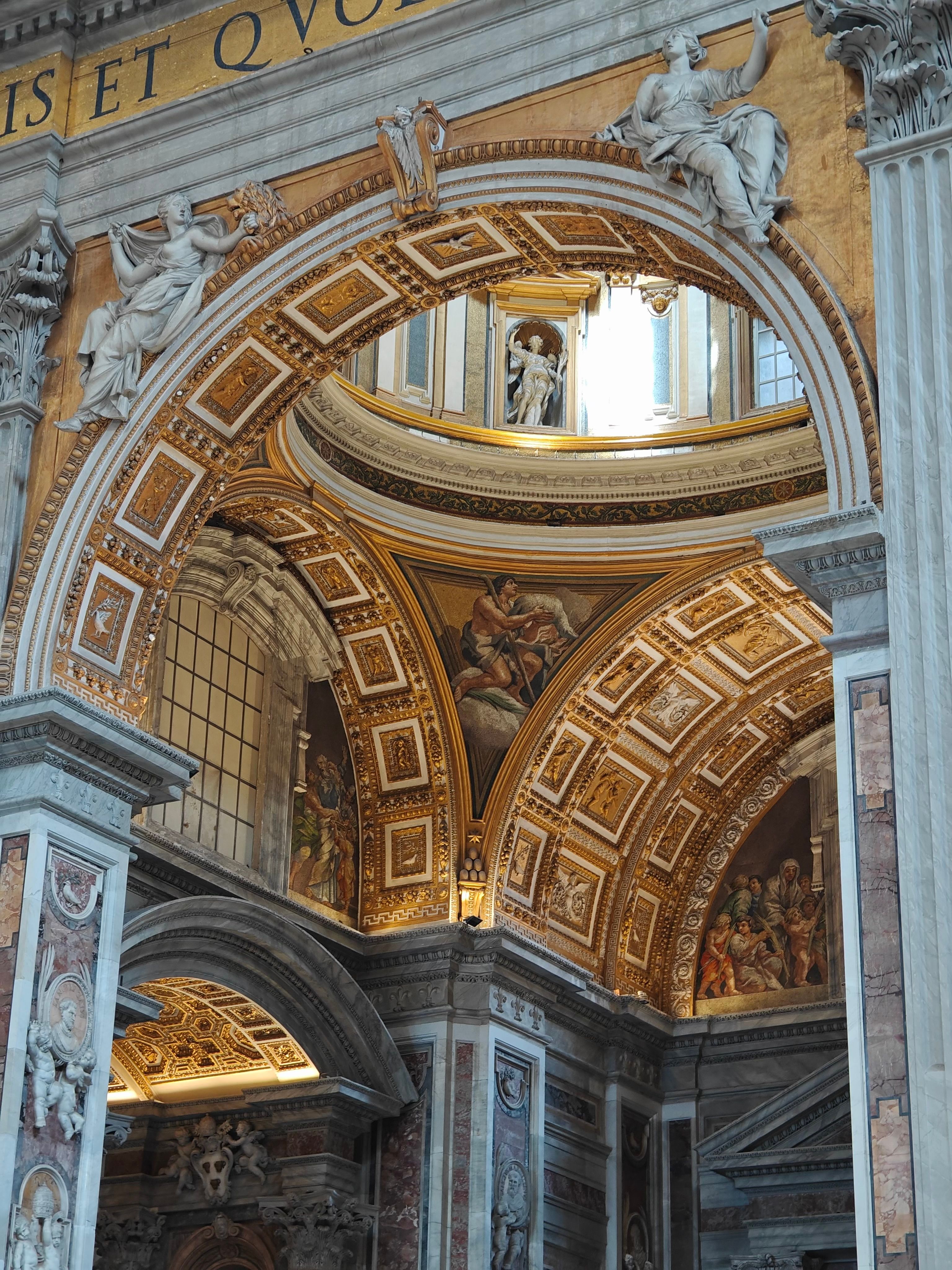 Detailed interior shot showcasing St. Peter's Basilica's ornate architectural elements and artwork.