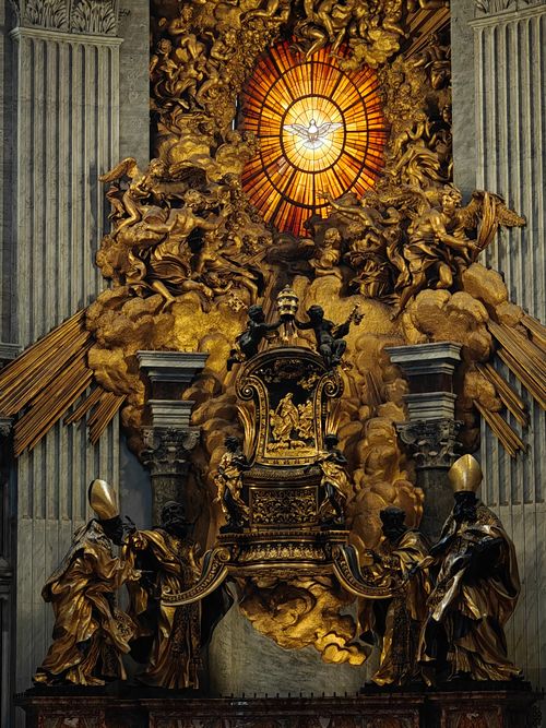 Free The Throne of St. Peter in St. Peter's Basilica, Rome, with dramatic lighting and Baroque sculptures. Stock Photo