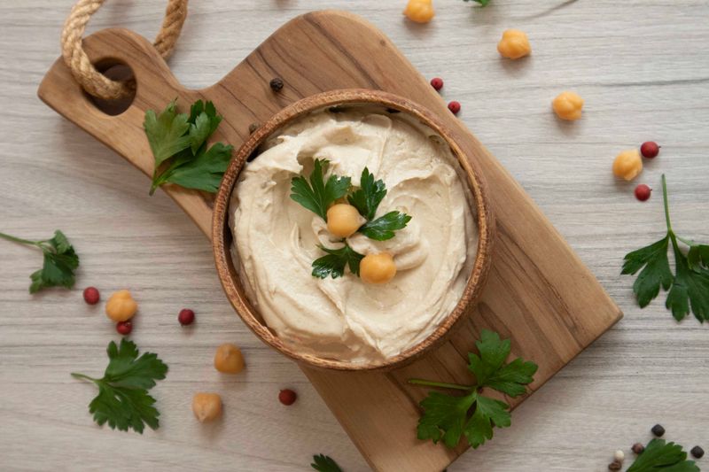 turkey hummus pinwheels sliced on a board