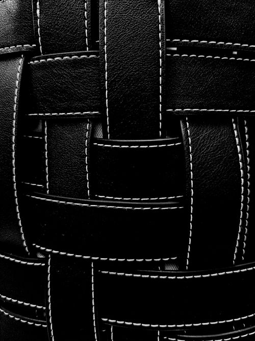 Free Detailed close-up of black leather weave texture with visible stitching. Stock Photo
