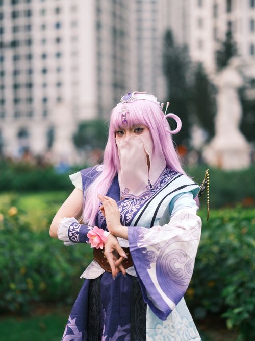 Free A cosplayer in intricate costume poses in a colorful park in Vietnam, evoking fantasy and creativity. Stock Photo