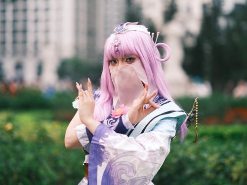 Free Captivating purple-haired cosplay performer posing outdoors in Vietnam, showcasing intricate costume design. Stock Photo