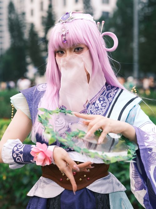 Free A colorful depiction of a cosplayer in traditional-inspired costume at a Vietnamese outdoor setting. Stock Photo
