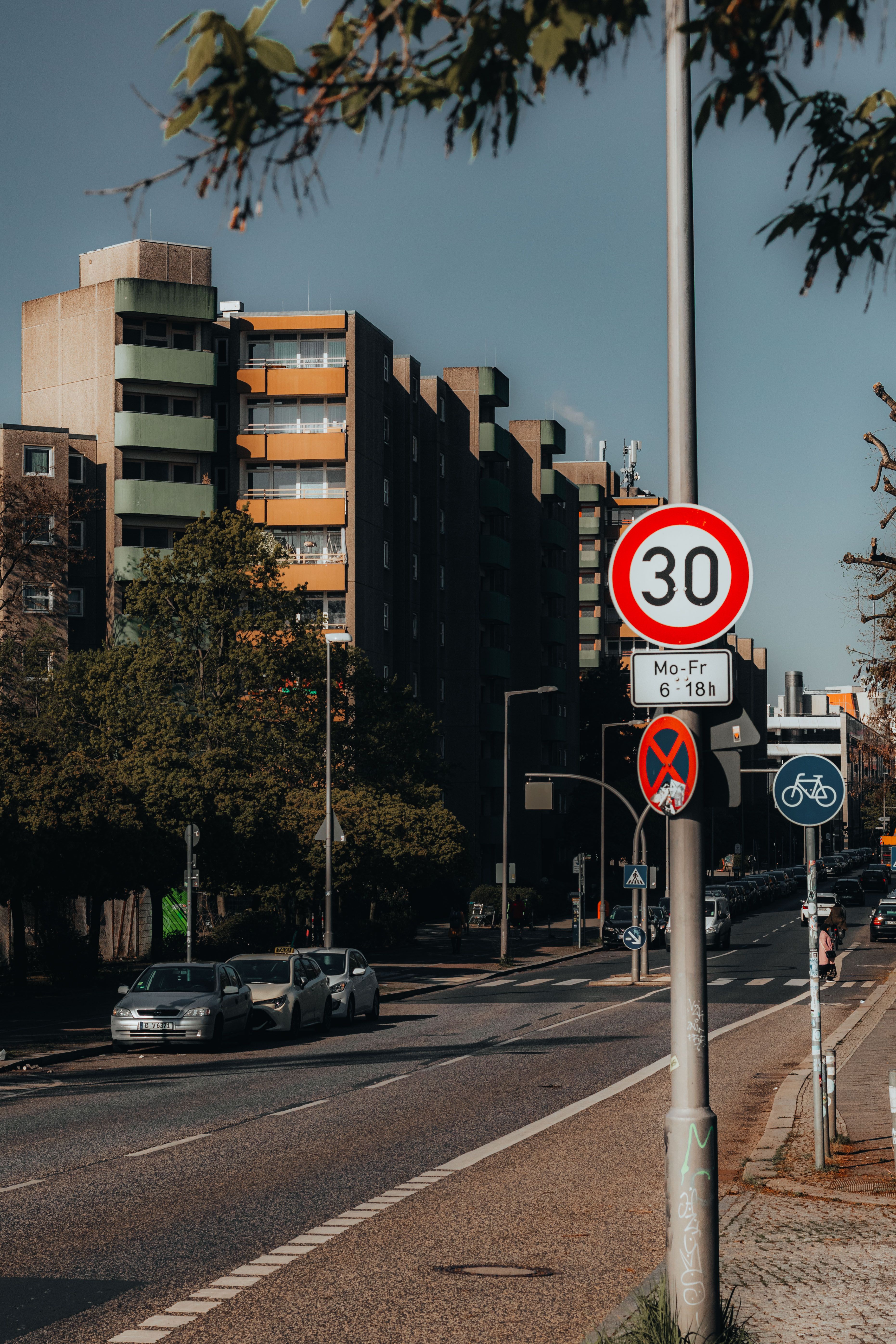 Urban Street Scene in Berlin with Traffic Signs · Free Stock Photo